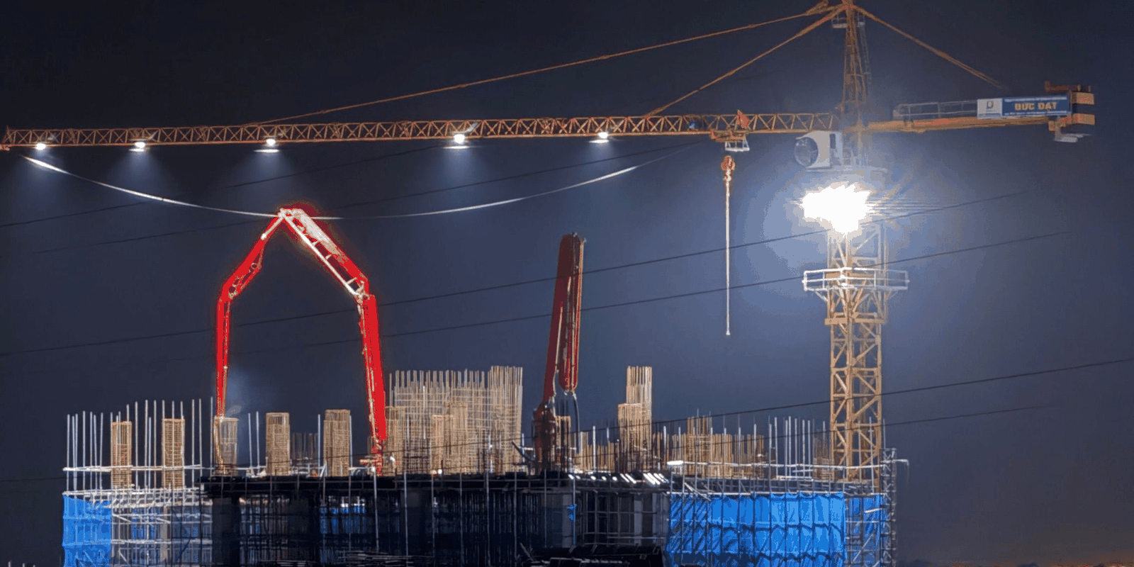 Light tower lighting a construction site at dusk in Malaysia